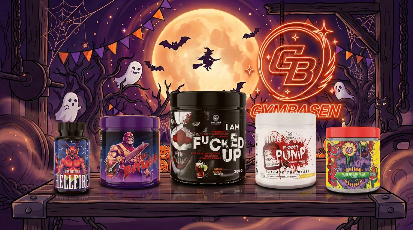 Halloween-produkter från GymBasen på ett mörkt träbord framför en glödande GymBasen-skylt